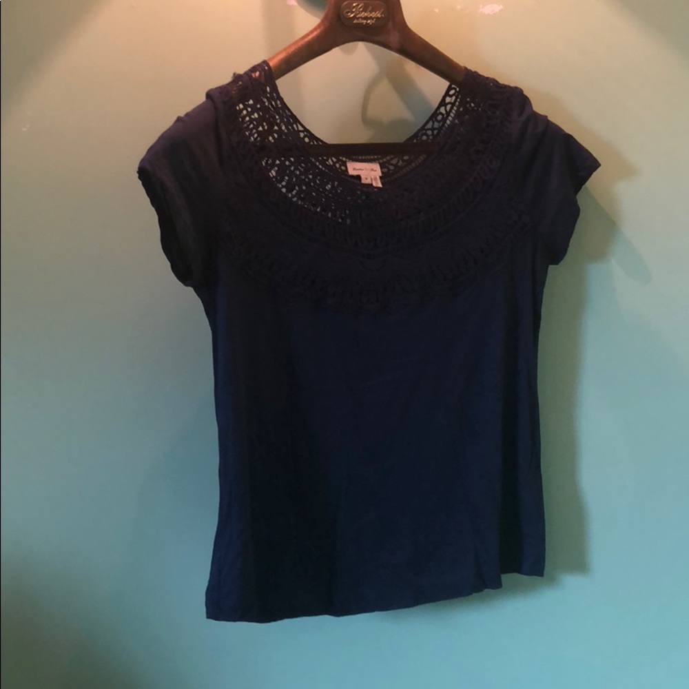 Navy top with scoop neck lace cutouts